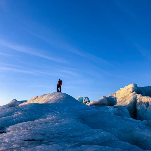 person on top of an ice peak