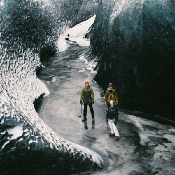 people below in a glacier