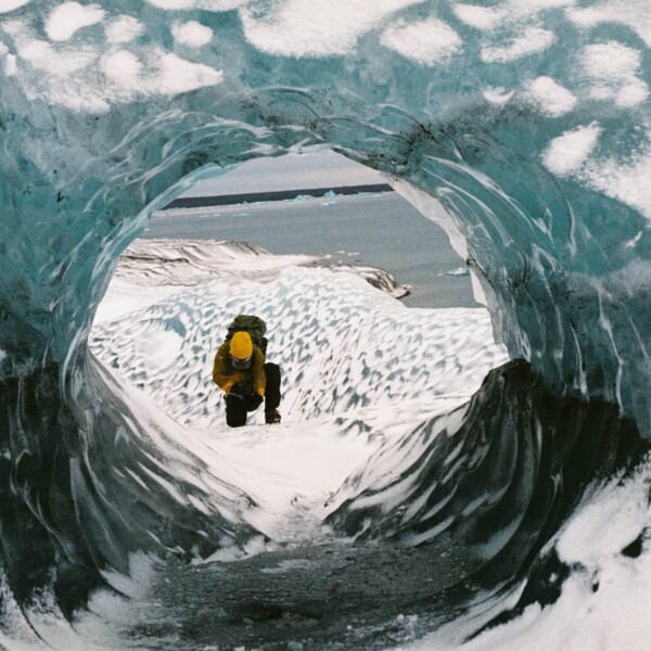 man seen through an ice hole