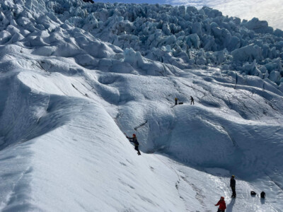 climber with icefall backdrop
