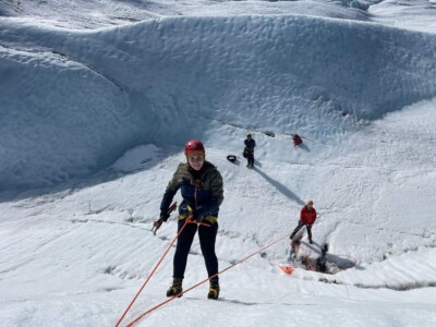 man being lowered from top rope