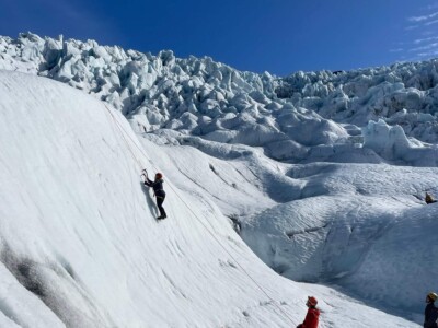 iceclimber with belayer icefall